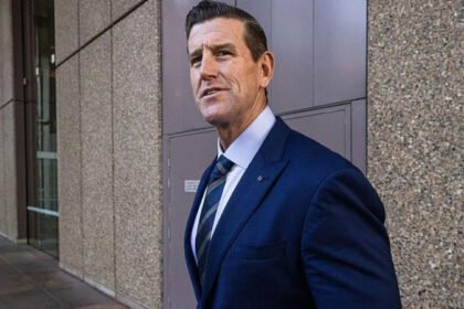 Ben Roberts Smith Released on Bail in War Crimes Case Bail granted after custody Australia’s most decorated living soldier, Ben Roberts Smith, has been released on bail after spending time in custody over serious war crime allegations. He left Silverwater Prison in Sydney after a court approved his release under strict conditions. Murder charges linked to Afghanistan service The former SAS corporal faces five counts of murder as part of a war crimes investigation. Prosecutors allege he was involved in the killing of unarmed Afghan detainees between 2009 and 2012. They also claim he either carried out the killings or ordered subordinates to do so. Roberts Smith denies all allegations against him. Court decision and bail reasoning Judge Greg Grogin said the case is unusual and could take years to reach trial. He noted Roberts Smith may remain in custody for a long time if bail was refused. The judge accepted that conditions could manage risks such as witness interference or flight. Bail conditions imposed The court set strict rules for his release. He must report to police three times a week and allow access to his electronic devices. His passport has been cancelled, and he cannot leave Australia. A surety of A$250,000 was also ordered. The judge warned that any breach would lead to immediate arrest. Legal background and defamation case The criminal charges follow a 2023 civil defamation case brought by Roberts Smith against Nine newspapers. The court found, on the balance of probabilities, that some murder allegations had substantial truth. That civil trial was the first time an Australian court examined claims of war crimes involving Australian forces. Upcoming legal battle The upcoming criminal trial will require proof beyond reasonable doubt, a much higher legal standard than the civil case. His legal team argues the case is complex and unprecedented in Australia. They also claim intense media coverage could affect his right to a fair trial.