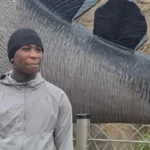 Boy, 14, Fatally Shot in Woolwich: Police Appeal for Information Incident Overview A 14-year-old boy, identified as Eghosa Ogbebor, was shot dead in Woolwich, southeast London. Police received reports of gunfire on Lord Warwick Street at around 3:40 pm BST on Thursday. Emergency services arrived quickly and tried to help him, but he sadly died at the scene. Authorities have informed his family. Arrests and Investigation Police have arrested two boys, aged 14 and 16, along with an 18-year-old man on suspicion of murder. Detectives are continuing their investigation and are asking the public for help. They are also requesting any CCTV or dashcam footage that could assist with the case. Witness Accounts People in the area described a frightening scene. Customers at a nearby pub, The Greyhound, rushed inside after hearing gunshots. Staff and witnesses reported panic as people tried to secure the doors and stay safe. A staff member, Sofia Pereira, said she heard a loud bang and saw people running into the pub in fear. She mentioned that one individual appeared to be carrying a weapon, which added to the panic. Local Reaction Residents expressed shock over the incident. One 18-year-old local said the shooting felt unreal and unsettling. She also noted that there has been increasing violence in the area over recent years, making the situation even more concerning. Police Appeal Authorities are urging anyone with information to come forward. They believe even small details could help move the investigation forward.