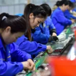 China’s manufacturing and export economy faces rising costs as Iran conflict disrupts oil supply routes. Fabric traders and factories feel pressure