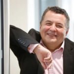 Can a digital twin turn workers into superworkers? What is Digital Richard? Digital Richard, an AI-based digital twin for Richard Skellett is created by Digital Richard. The interface is a screen-based version of Richard Skellett. The system learns through his calls, meetings, documents and presentations. It also analyzes how he solves his problems and thinks. It doesn't behave like an ordinary chatbot. In a structured manner, it reflects both his knowledge and working style. The System Works ChatGPT is used to build the digital twin. The system processes large quantities of data, both personal and professional. Then, it organizes the information to respond according to Skellett’s reasoning and decisions. Separate areas are available for both work and private use. Only colleagues who work together can access information related to business. Skellett relies on the Twin to help him make decisions and present clients. He also uses it to manage his daily tasks. Effects on the Workplace Bloor Research is expanding the use of this method across their global team. It is the goal to make a digital copy of each employee. Some employees use the digital twin before retiring to reduce their workload. Some workers use their digital twin during extended leave. One case involved a digital twin who handled parts of the work for a marketing worker on maternity. It reduced the need to hire temporary employees. This approach is expected to become the standard in knowledge-based jobs. The Industry as a Whole Experts in technology predict that the digital replication of employees will be commonplace within a few years. Gartner, for example, expects this sector to grow rapidly. AI-based systems are being tested by companies that mimic communication and work habits. There have also been reports that large tech companies are also exploring the same ideas with senior executives. The Meaning of This Could Be By automating routine tasks and assisting in decision-making, digital twins can increase productivity. Workers could focus more on high-value work. This raises issues of control, responsibility, and privacy. These systems will require clear guidelines for companies.