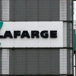 French cement company found guilty of paying armed groups in Syria A court finds that illegal payments are linked to Syria-related operations The Paris Court ruled French cement firm Lafarge funded armed groups, such as Islamic State in Syria, to maintain its cement factory's operation during the civil conflict. The judges said that the company had paid out millions of dollars in protection funds between 2013 and 2014. Total cost was approximately 6.5 millions dollars. It was a goal to continue business at the northern Syria location as conflict escalated. Eight former employees were also found guilty of financing terrorism by the court. Former chief executive Bruno Lafont was sentenced to six years in prison. The payment method Lafarge employees arranged payment to several armed groups that controlled territory near the plant, according to investigators. Included in these payments were funds to ensure safe passage, access to raw material and for the payment of fees. A portion of the money used was to purchase raw materials from regions controlled by Islamic State. The judges said that the agreement effectively established a working relation with organisations proscribed. Judges condemn corporate decisions The judge Isabelle Prevost Desprez stated that the payments allowed armed groups to strengthen their control of resources. This allowed the groups to finance attacks in Europe and Middle East. Court ruled the financial survival of the factory drove company decisions. The judges said that economic interests came first before ethical and legal limits. Defense arguments are rejected Former executives claimed that the continued operation of local operations protected workers. Former executives said that leaving the site would have placed workers at risk. This justification was not accepted by the court. The court ruled the payments supported terrorist activities. Wider legal consequences Cement plant Jalabiya, purchased in 2008, began operating in 2010 - shortly before the Syrian war began. Holcim now owns the company. The company was fined over one million Euros. Separate investigations into crimes against humanity are still underway. It is the first time in France that a company was convicted of financing terrorism.