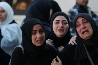 Israel Lebanon Conflict Escalates as Strikes Intensify and Talks Approach Escalation of Violence in Southern Lebanon and Northern Israel Israeli air strikes and Hezbollah rocket fire increased over the weekend across southern Lebanon and northern Israel. Both sides signaled that fighting would continue despite growing diplomatic activity. The conflict has expanded since early March after renewed clashes between Israel and Hezbollah. Israel says its military campaign targets Hezbollah positions in Lebanon. Hezbollah continues rocket attacks toward northern Israel in response. Rising Civilian and Military Casualties Lebanese health authorities report that Israeli strikes have killed 2055 people in Lebanon since fighting resumed on 2 March. They also say 167 people died since Friday. Israel reports that Hezbollah attacks have killed 12 soldiers and 2 civilians during the same period. Among recent civilian victims was a child, around two years old. She survived an earlier strike on her home in southern Lebanon. She later died when another strike hit during her father’s funeral. Her seven year old sister suffered severe burns and remains in hospital. A Red Cross rescuer also died during weekend operations. The organization says a drone strike hit its team while they carried out a humanitarian mission. The Israeli military has not confirmed this claim. Diplomatic Efforts and Upcoming Talks Officials from Lebanon, Israel, and the United States plan to meet in Washington on Tuesday. Lebanese officials say the talks aim to set conditions for a ceasefire. If progress is made, formal negotiations may follow. Lebanon continues to push for an end to the war and a full Israeli withdrawal from its territory. Israel, however, states it will not negotiate a ceasefire with Hezbollah under current conditions. Statements from Political Leaders Lebanon’s prime minister said diplomatic efforts continue despite heavy fighting. He emphasized ongoing negotiations aimed at stopping the war. Israel’s prime minister maintained a firm position while visiting troops in southern Lebanon. He said Israeli forces would continue operations in what he described as a security zone. Israel says this zone extends up to ten kilometers inside Lebanese territory to prevent attacks on Israeli communities. Disputed Military Claims Israeli forces claim they killed more than 20 Hezbollah fighters operating from a hospital area in Bint Jbeil. Lebanese authorities deny this and accuse Israel of striking civilians and medical facilities. Heavy air strikes were also reported in multiple towns in southern Lebanon, including areas that saw major fighting during earlier conflicts between Israel and Hezbollah.