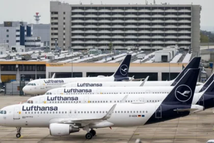 Lufthansa Cuts 20,000 Flights as Fuel Prices Surge Rising Fuel Costs Force Major Flight Reductions Lufthansa has announced it will cancel around 20,000 short-haul flights this summer. The airline says rising fuel prices have made many routes too expensive to operate. Jet fuel prices have sharply increased since the start of the conflict involving the US, Israel, and Iran. The situation has slowed production and disrupted supply routes across the Middle East. Airlines Pass Costs to Travelers Other major airlines, including Air France–KLM and Delta Air Lines, have also reduced some flights. At the same time, many carriers have raised ticket prices to cover higher costs. Industry experts warn that ticket prices may continue to rise. Travelers could also face more cancellations if the situation does not improve. Middle East Supply Disruptions Impact Europe The Middle East plays a key role in global jet fuel supply. It provides about half of Europe’s aviation fuel imports. Much of this supply passes through the Strait of Hormuz. Iran has restricted access to this route in response to recent military actions. This has caused delays and reduced fuel availability. The International Energy Agency recently warned that Europe could face jet fuel shortages within weeks. However, UK officials and airlines say they have not yet seen major supply disruptions. Lufthansa Adjusts Network Strategy Lufthansa confirmed it will scale down its European routes. However, it will continue to operate long-haul international flights. The airline said this move will improve efficiency and reduce fuel use. It expects to save around 40,000 metric tons of jet fuel. Fleet Changes and Route Cuts The airline has also decided to speed up the closure of its CityLine operations. It plans to retire 27 aircraft as part of this move. Lufthansa said higher fuel costs and ongoing labor issues influenced this decision. Some of the first route cuts have already started. These include flights from Frankfurt to cities in Poland and Norway.