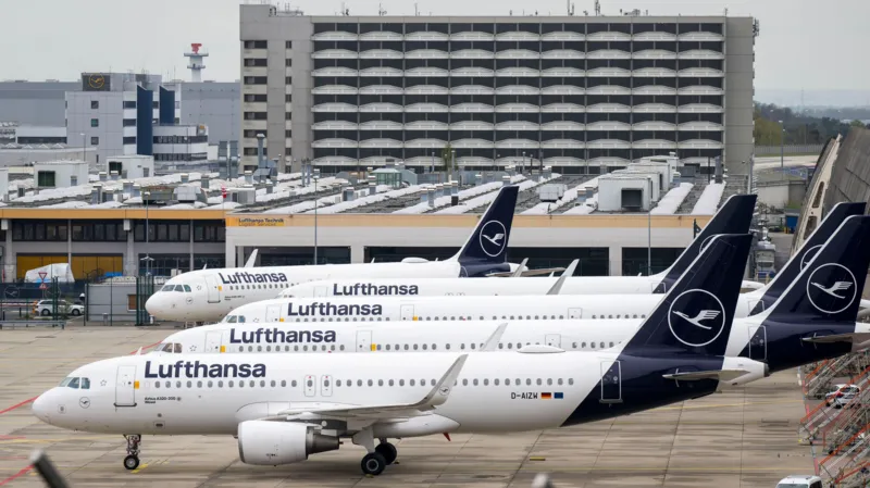 Lufthansa Cuts 20,000 Flights as Fuel Prices Surge Rising Fuel Costs Force Major Flight Reductions Lufthansa has announced it will cancel around 20,000 short-haul flights this summer. The airline says rising fuel prices have made many routes too expensive to operate. Jet fuel prices have sharply increased since the start of the conflict involving the US, Israel, and Iran. The situation has slowed production and disrupted supply routes across the Middle East. Airlines Pass Costs to Travelers Other major airlines, including Air France–KLM and Delta Air Lines, have also reduced some flights. At the same time, many carriers have raised ticket prices to cover higher costs. Industry experts warn that ticket prices may continue to rise. Travelers could also face more cancellations if the situation does not improve. Middle East Supply Disruptions Impact Europe The Middle East plays a key role in global jet fuel supply. It provides about half of Europe’s aviation fuel imports. Much of this supply passes through the Strait of Hormuz. Iran has restricted access to this route in response to recent military actions. This has caused delays and reduced fuel availability. The International Energy Agency recently warned that Europe could face jet fuel shortages within weeks. However, UK officials and airlines say they have not yet seen major supply disruptions. Lufthansa Adjusts Network Strategy Lufthansa confirmed it will scale down its European routes. However, it will continue to operate long-haul international flights. The airline said this move will improve efficiency and reduce fuel use. It expects to save around 40,000 metric tons of jet fuel. Fleet Changes and Route Cuts The airline has also decided to speed up the closure of its CityLine operations. It plans to retire 27 aircraft as part of this move. Lufthansa said higher fuel costs and ongoing labor issues influenced this decision. Some of the first route cuts have already started. These include flights from Frankfurt to cities in Poland and Norway.