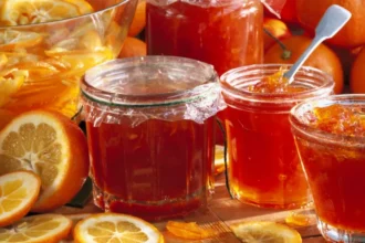 UK Marmalade May Be Renamed Under New Post Brexit Food Rules Key Subheading: EU Food Deal Could Change Marmalade Labelling in the UK The UK government is considering changes to marmalade labelling as part of a new food agreement with the EU. If the deal is approved, jars of the traditional spread may need to be labelled as “citrus marmalade” in shops across the UK. This update is linked to changes in EU food laws aimed at improving trade and reducing barriers for exporters. While the product itself will stay the same, the naming rules could shift to match international standards. Why the Name Marmalade Is Changing Under current UK rules, marmalade refers only to spreads made from citrus fruits like oranges. This definition dates back to regulations adopted before Brexit. Other fruit spreads are usually called jam. The EU is now expanding its definition. From June, non citrus fruit spreads can also be marketed as marmalade across Europe. However, citrus based versions will need to be labelled more clearly as “citrus marmalade”. This change follows long standing debates across Europe, where the word marmalade has been used differently in languages such as German, Spanish, and Italian. Impact on UK Consumers and Businesses The UK government says the product itself will not change. Shoppers will still find the same marmalade in stores. The difference will be in how it is labelled. Officials say the updated rules could help British producers export more easily by reducing red tape. The aim is to align with global standards and improve trade with EU markets. However, some concerns remain. Earlier assessments suggested that new naming rules could confuse consumers in the UK. It is still unclear whether products like “strawberry marmalade” will be allowed in British supermarkets. When Will the Changes Happen The timeline is not fixed yet. The changes may come into effect around 2027 if the wider EU food deal is agreed. It is also unclear whether the rules will apply before or after that date. What This Means for the Future This update reflects ongoing efforts to align UK food regulations with international systems. While it may seem like a small change, it highlights how trade agreements can influence everyday products and their labels.