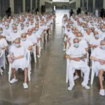 Mass Trial of 486 MS13 Suspects Begins in El Salvador Background of the Case A large scale trial has started in El Salvador involving 486 people accused of belonging to the MS13 gang. Authorities say the suspects are linked to a wide range of serious crimes carried out over a ten year period from 2012 to 2022. Charges and Allegations Prosecutors accuse the group of involvement in more than 47,000 crimes. These include murder, extortion, drug trafficking, arms trafficking, disappearances, and femicide. Officials also say some suspects played roles in violent events in March 2022 when 87 people were killed within a single weekend. Government Response The attorney general’s office says it has strong evidence and expects the court to issue maximum penalties where guilt is proven. The government launched a tough anti gang campaign after the 2022 violence, calling it a war on gangs. Since then, large scale arrests have taken place under a state of emergency that expanded police powers and limited certain constitutional protections. Human Rights Concerns United Nations experts and human rights groups have raised concerns about the trial. They argue that mass proceedings can weaken the right to a fair defense and the presumption of innocence. They also warn that emergency powers have led to possible arbitrary detentions. Despite this, government supporters claim the measures have made the country safer. MS13 Background MS13 is a transnational criminal organization that began in Los Angeles during the 1980s. It was formed by migrants who had fled the Salvadoran civil war. Today, it operates mainly across Central America and has been classified as a terrorist organization by the United States. Legal Process and Current Status Authorities report that 413 suspects are currently in custody, while 73 others are being tried in their absence. The attorney general’s office claims the group has long used violence to control territory and spread fear, affecting both public safety and economic development.