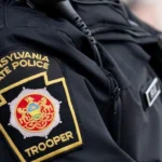 Tragic House Explosion in Clinton County A devastating explosion destroyed a home in Lamar Township, Clinton County, Pennsylvania, on Sunday morning. Authorities confirmed that a 34 year old mother and her six children died in the incident. The children included four boys and two girls, aged between three and eleven. Emergency services arrived at about 08:30 local time after reports of an explosion. They found the house fully on fire and heavily damaged. Fire Spread Before Rescue Could Begin Firefighters reached the scene quickly but faced extreme conditions. The flames spread through the structure at high speed. Officials reported that responders could not safely enter the home to search for survivors. The intensity of the fire caused part of the house to collapse before rescue operations could begin inside the structure. Suspected Cause Under Investigation Investigators believe a propane leak inside the home may have triggered the explosion. However, they have not confirmed the final cause yet. Authorities continue to examine the site and gather evidence. Police stated that the investigation remains active and further findings will be shared once available. Witness Account of the Explosion A nearby resident described hearing a loud blast during breakfast. She said the impact was strong enough to be felt inside her home. She looked outside and saw flames coming from the house. Within a very short time, the entire structure was engulfed in fire. Other neighbors rushed out to call emergency services. Fire crews arrived soon after but reported that the fire had already consumed most of the building. Community Reaction and Ongoing Inquiry The local community expressed shock and grief over the loss of a young family. Neighbors described the fire as fast and overwhelming, leaving almost no time for intervention. Authorities continue to investigate the explosion to determine exactly what caused the propane leak and how the fire spread so quickly.