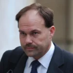 The family of the murderer who hid his wife's body was outraged, but he received a pardon. The Case Background Glyn Razzell was convicted of murdering his wife Linda Razzell in 2003. He has been granted parole. This decision has been met with strong reaction, particularly from the family of victim. Linda vanished in 2002, while on her way to Swindon. She was divorcing Razzell at the time. She had frozen his accounts a few days before her disappearance. Investigators were able to build a solid case even though her body wasn't found. The forensic evidence, which included traces of blood from her in the car that was linked to Razzell's, contributed to his conviction. He was sentenced to life imprisonment with a minimum of 16 years. The Parole Case and its Legal Context Razzell was reviewed by the Parole board multiple times. Previous applications for release, such as one made under Helen's Law 2021, were denied. Helen's Law obliges officials to take into account the psychological harm that is caused by offenders who refuse to disclose the location of the remains of victims. It does not, however, prevent release. The board's latest assessment in January 2026 concluded that Razzell does not pose a threat to public safety. The members noted Razzell's behavior while in jail and his ability, when not under custody, to adhere to rules. The court also recognized the hurt caused by his refusal of revealing where Linda's remains are. They still emphasized the fact that the risk of harm to the public is the main factor when deciding whether or not to grant parole. Families React and Continued Pain Linda's family members have been deeply affected by the ruling. Greg Worrall said that the ruling has added further emotional stress to the lives of those who loved Linda. They believe that the decision weakens Helen's law. The family argues that justice is incomplete until answers are given about Linda's last resting place. Government Response Now, the Ministry of Justice will review this decision. The officials are examining whether or not they can contest it by way of a judicial reconsideration. If valid grounds can be found, this step may delay the release or even reverse it. Justice vs Public Safety: The key issue The case illustrates a delicate balance. The authorities must balance public safety with the suffering experienced by victims' families. The system is primarily focused on managing risk, but families are often looking for closure and accountability. The absence of answers is causing frustration and anger in this case.