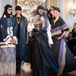 Paris hosts its first Modest Fashion Week, featuring global designers who present floral dresses, flowing silhouettes, and inclusive modest style on the runway.