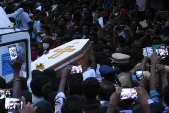 Indian police officers sentenced to death for deaths in custody Case Background In India, nine police officers have been found guilty for the murder of a father in prison and his son during the lockdown 2020 Covid. This case occurred in Tamil Nadu where victims were arrested after allegedly maintaining their mobile store open during the restrictions. P Jeyaraj, and Benicks his son, both died soon after they were arrested. They were beaten brutally inside the jail, according to court testimony. The Brutality of Custody According to the sentencing judge, both officers were stripped naked and assaulted in public by police officers. The judge determined that both men were assaulted and stripped in front of each other. The officer also said that they had abused their power and shown no respect for life. Court's Verdict Last month the court found them guilty, and the judge handed out the death sentence on Monday. The judge rejected all requests for leniency, and stated that the defendants should not be given a reduced sentence based on age or background. All the police officers had been educated, and were fully accountable for their actions. In 2020, one of the accused officers died due to Covid. The remaining nine have been sentenced. They can appeal. Public Reactions and Protests Tamil Nadu was enraged by the case. Public figures and opposition leaders raised their voices in support of justice. Social media was flooded with messages of support from prominent personalities including politicians and an Indian cricketer. Wider Concerns about Police Brutality The case brought to light the brutality of police in India. Human rights organizations report that hundreds die each year in police custody. The fact that they also mention the use of torture to obtain confessions raises serious questions about police practices. In early this year, experts from the United Nations urged India's police system to be aligned with international standards for human rights.