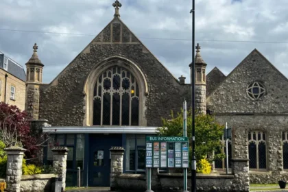 Police Confirm No Rape Outside Epsom Church After Investigation Surrey Police have closed their investigation into an alleged rape outside a church in Epsom. Officers confirmed that no sexual offence took place. The case began when a woman in her 20s reported that she had been raped outside Epsom Methodist Church on 11 April. She had just left Labyrinth nightclub earlier that night. Her report quickly spread, causing concern across the town. Investigation Findings Police carried out a detailed investigation. They reviewed CCTV footage, spoke to witnesses, conducted house visits, and completed forensic tests. After examining all evidence, officers found no sign of a sexual assault. Instead, they believe the woman suffered an accidental head injury during her night out. This injury likely caused confusion, which led to the initial report. Authorities confirmed that the woman agreed to share this update. She is still receiving support from relevant services. A police spokesperson said they treat every report of sexual offences seriously and handle each case with care and sensitivity. Public Reaction and Disorder The initial report triggered strong public reactions. Large groups gathered in Epsom, demanding information about suspects. However, police did not release any descriptions due to a lack of confirmed details. As tensions rose, protests turned disruptive. Some individuals threw objects at police officers. Authorities responded by deploying riot police to control the situation. Five people, aged between 15 and 23, were later arrested. They face charges related to public order offences and criminal damage. All have been released on bail. Misinformation and Community Impact Police also addressed false claims circulating during the unrest. Some people targeted hotels and homes based on rumors that asylum seekers were involved. Authorities stated that these claims were completely untrue. Officials criticized the violence and misinformation. Surrey Police and Crime Commissioner Lisa Townsend described the incidents as “shameful” and “mindless.” She also noted that some individuals involved were not from the local area. Police Statement Surrey Police emphasized their commitment to thorough investigations. They confirmed that this case involved careful evidence review before reaching a conclusion. The force also urged the public to avoid spreading unverified information, as it can lead to unnecessary fear and disorder.
