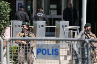 Istanbul Israeli Consulate Shooting: One Gunman Killed, Two Injured After a gun battle with the police, one of two attackers was killed and another injured in a shooting near the Israeli Consulate in Istanbul. The incident has been described by authorities as an act of serious terrorism that raises concerns over security. Attack Near Consulate Sparks Panic In Istanbul, the incident occurred in Besiktas's bustling district where Israel consulates are located. Officials claim that the attackers drove from Izmit to Istanbul in a rental car, and then attacked in broad daylight. The gunfire between suspects and officers lasted several minutes. The witnesses reported that the shooting was loud and continued, causing panic in nearby people. Police Respond, One Attacker Killed The security forces responded quickly to the attack and engaged with the attackers. During the gunfight, one of the attackers was killed and two other suspects were injured. Later, authorities confirmed that two of the suspects were brothers. In the shooting, two police officers also sustained injuries. Two police officers were also injured in the shootout. One was hurt on the leg, and the other got hit by a bullet to the ear. Both officers are in stable conditions and receiving medical attention. Extremist Groups and Suspects The dead attacker was identified by officials as Yunus E.S. The authorities stated that the attacker had links with a religious extremist group, which is widely thought to be Islamic State. No organization has yet claimed official responsibility for this attack. The investigation is also looking into the digital communications between suspects. No Diplomatic Staff Harmed The consulate was empty at the time the attack occurred. It prevented further violence and possible casualties. The police sealed the area off for several hours following the incident. Online videos show an intense police presence at the incident, as well as emergency response teams. The Government condemns the Attack The Turkish president Recep Tayyip Erdoan condemned the attack, calling it an "heinous terror act." Erdogan stressed that such incidents will not disrupt public safety or trust. The authorities have confirmed that the investigation is ongoing and are taking strict measures to avoid similar incidents occurring in future.