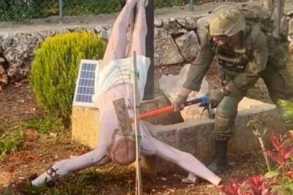 Israeli Soldier Accused of Vandalizing Jesus Statue in Lebanon Sparks Outrage Incident Triggers Global Reaction A wave of anger has spread after a viral image showed an Israeli soldier striking a statue of Jesus with a sledgehammer in southern Lebanon. The act shocked many, especially within Christian communities, who see the cross as a sacred symbol. Israel’s Prime Minister said he was deeply shocked and saddened by the incident. The country’s foreign minister also issued an apology. He acknowledged the pain caused to Christians and called the act unacceptable. Local Community Condemns the Act Residents say the statue stood outside a family home near the village of Debel. This area is one of the few places where civilians have stayed despite ongoing conflict. Father Fadi Flaifel, a local church leader, strongly condemned the act. He said the destruction of religious symbols goes against basic human values and respect. He also claimed that similar incidents have happened before, raising concern among locals. Military Response and Investigation The Israel Defense Forces stated that they take the matter seriously. Officials said the soldier’s behavior does not reflect the values expected from their forces. They also confirmed that action will be taken against those responsible. The military added that it is working with the Christian community to restore the damaged statue. This step aims to rebuild trust and show respect for religious beliefs. International Pressure Builds The reaction has not been limited to the region. The United States ambassador to Israel called for strict and visible consequences. He stressed the need for accountability to prevent such actions in the future. Ongoing Conflict in Southern Lebanon The incident comes during a fragile ceasefire between Israel and Lebanon. Thousands of Israeli troops remain in southern Lebanon. The ceasefire has paused weeks of intense fighting between Israeli forces and Hezbollah. Despite the agreement, both sides have accused each other of violations. Israel says its military presence aims to stop cross border attacks and missile threats. The conflict began after Hezbollah launched rockets in support of Iran. This happened shortly after Israel and the United States started military action against Tehran. Rising Humanitarian Concerns The ongoing conflict has caused major human suffering. Lebanese officials report that more than a million people have been displaced. Over 2,290 people have lost their lives, including children and healthcare workers. On the Israeli side, officials report the deaths of several soldiers and civilians due to attacks by Hezbollah. The situation remains tense, with fears of further escalation.