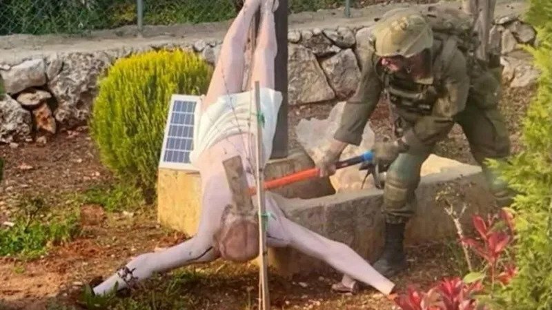 Israeli Soldier Accused of Vandalizing Jesus Statue in Lebanon Sparks Outrage Incident Triggers Global Reaction A wave of anger has spread after a viral image showed an Israeli soldier striking a statue of Jesus with a sledgehammer in southern Lebanon. The act shocked many, especially within Christian communities, who see the cross as a sacred symbol. Israel’s Prime Minister said he was deeply shocked and saddened by the incident. The country’s foreign minister also issued an apology. He acknowledged the pain caused to Christians and called the act unacceptable. Local Community Condemns the Act Residents say the statue stood outside a family home near the village of Debel. This area is one of the few places where civilians have stayed despite ongoing conflict. Father Fadi Flaifel, a local church leader, strongly condemned the act. He said the destruction of religious symbols goes against basic human values and respect. He also claimed that similar incidents have happened before, raising concern among locals. Military Response and Investigation The Israel Defense Forces stated that they take the matter seriously. Officials said the soldier’s behavior does not reflect the values expected from their forces. They also confirmed that action will be taken against those responsible. The military added that it is working with the Christian community to restore the damaged statue. This step aims to rebuild trust and show respect for religious beliefs. International Pressure Builds The reaction has not been limited to the region. The United States ambassador to Israel called for strict and visible consequences. He stressed the need for accountability to prevent such actions in the future. Ongoing Conflict in Southern Lebanon The incident comes during a fragile ceasefire between Israel and Lebanon. Thousands of Israeli troops remain in southern Lebanon. The ceasefire has paused weeks of intense fighting between Israeli forces and Hezbollah. Despite the agreement, both sides have accused each other of violations. Israel says its military presence aims to stop cross border attacks and missile threats. The conflict began after Hezbollah launched rockets in support of Iran. This happened shortly after Israel and the United States started military action against Tehran. Rising Humanitarian Concerns The ongoing conflict has caused major human suffering. Lebanese officials report that more than a million people have been displaced. Over 2,290 people have lost their lives, including children and healthcare workers. On the Israeli side, officials report the deaths of several soldiers and civilians due to attacks by Hezbollah. The situation remains tense, with fears of further escalation.