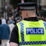 Police Arrest Two in West Midlands Drug Sales Case Police in the West Midlands have arrested a man and a woman for allegedly supplying illegal drugs through local shops. Officers carried out the arrests on Thursday in Dudley as part of an ongoing crackdown on street-level drug activity. Authorities confirmed that both suspects remain in custody for questioning. Investigators also stated that more arrests are likely as the operation continues. Shops Used as Drug Distribution Points Recent findings exposed a worrying trend. Small retail shops across several towns have been used to sell illegal substances. These include cocaine, cannabis, laughing gas, and even prescription pills. Undercover checks revealed that some shopkeepers or associates openly offered drugs to customers. This has raised serious concerns about how easily such substances can reach the public. Nationwide Pattern Raises Alarm The issue is not limited to one area. Reports from multiple regions across the UK show similar patterns. Investigators have linked over 70 shops and related locations to drug activity. Authorities discovered dangerous substances such as crystal meth and heroin in these places. Law enforcement agencies believe organized criminal networks are behind this trend. These groups use small businesses as a cover to expand their operations. Police Response and Ongoing Investigations West Midlands Police have made it clear that they will not tolerate this activity. Officers are actively investigating multiple leads and working to identify others involved. A police spokesperson said they are aware of growing public concern. They reassured residents that strong action is already underway to stop illegal drug sales and protect communities. Government Plans Stronger Action The UK government has also responded to the situation. Officials have promised stricter measures to tackle crime on high streets. Plans include increasing the number of visible neighbourhood police officers. Authorities also want to give officers more power to deal with anti-social behaviour and illegal trade in shops. Political Reactions to Rising Crime Political leaders have reacted strongly to the revelations. Some have described the situation as a sign of increasing lawlessness in towns and cities. Proposals include hiring thousands of additional police officers and using advanced surveillance tools in crime-prone areas. Leaders say these steps aim to restore safety and public confidence.