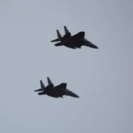South Korean Fighter Jets Collide Mid-Air After Pilots Attempt Aerial Photos A recent investigation in South Korea has revealed that a mid-air collision between two fighter jets in 2021 was caused by pilots trying to capture photos and videos during a mission. The incident took place near the central city of Daegu and involved two F-15K aircraft from the country’s air force. What Happened During the Flight According to findings released by the Board of Audit and Inspection, the jets were returning to base after completing their mission. During the flight, one pilot, flying as the wingman, decided to take photos using his personal phone. He wanted to mark his final mission with his unit. Taking such photos was reportedly common among pilots at the time. The pilot had even mentioned his plan during the pre-flight briefing, which suggests the practice was informally accepted. The Maneuver That Led to the Collision While taking photos, the wingman pilot suddenly changed position. He climbed higher and flipped the aircraft to get a better angle for the camera. This move brought the jet dangerously close to the lead aircraft. At the same time, the lead pilot asked a colleague to record video footage of the wingman jet. As the aircraft moved closer, the lead jet attempted a quick descent to avoid contact. Despite this effort, the two jets collided mid-air. The crash caused damage to both planes. The lead aircraft’s left wing was affected, while the wingman jet suffered damage to its tail stabiliser. Fortunately, all pilots survived without injuries. Financial Damage and Investigation Outcome The collision resulted in repair costs of around 880 million South Korean won, which equals roughly $596,000. Initially, the air force held the wingman pilot fully responsible and demanded he cover the entire cost. However, the pilot appealed this decision. He argued that the lead pilot was aware of the filming and did not stop it. After reviewing the case, the audit authority reduced the fine to 88 million won, placing partial responsibility on the air force as well. The report stated that the military failed to set clear rules about personal camera use during flights. This lack of regulation contributed to the risky behavior. Disciplinary Action and Aftermath Following the incident, the wingman pilot was suspended from duty. He later left the military and moved into a career in commercial aviation. The case has raised concerns about safety standards and discipline within the air force. It also highlights the risks of distractions during critical operations.
