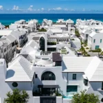 Alys Beach in Florida feels like Santorini but it's pure Gulf Coast The coastal town of Florida looks European Alys Beach in Florida is a coastal luxury community that reminds many visitors of Santorini. The bright white houses, the clean, modern lines and the peaceful streets make this a far cry from your typical American beach resort. You can see the white walls of the houses glowing in the sunlight as you stroll through town. You will walk along stone paths past quiet courtyards and elegant homes. The calm environment is enriched by purple flowers that hang from trellis. The Gulf of Mexico is visible in the distance. Its clear waters are surrounded by soft white sand. You might think of Greece, Spain or even the Caribbean when you first see it. At first glance, you might imagine Greece, Spain or the Caribbean. Small details remind you quickly that Florida is the place to be. The menus are filled with local seafood, and you can hear the Southern accents of the residents. The design is designed to make you feel as if you are in many different places. Alys Beach, located along Florida's picturesque 30A Highway, stands out among nearby coastal towns. The majority of beach towns around the region feature houses with colorful designs and a casual style. Alys Beach, on the other hand, follows an all-white architecture style. In 2004, the town's development was guided by a vision. The town's architecture is a blend of influences from various regions. Bermuda, Central America and Mediterranean countries are all represented in the design. The courtyards in Antigua and Guatemala have fountains. The island style architecture uses roof designs to collect rainwater. Tall structures at the entrance add Bermudian flair. Some places even hint at New Orleans' charm. The town has a relaxing yet elegant atmosphere thanks to the balconies and verandas that overlook tranquil courtyards. Enjoy a peaceful and walkable beach Alys Beach's layout is one of its most distinctive features. These streets were designed to be used by people walking or biking and not for cars. The streets are quiet and peaceful. You can hear the sea and bicycle bells instead of noise from the traffic. The town is easily accessible on foot. They will find small shops, cafes and spaces to relax in. A nearby coast adds to your experience. While the water is emerald-green, it feels like soft sand. This is the perfect place to relax. Florida Living: A New Vision Alys beach offers an alternative side to Florida. The beach town look is replaced by something refined and more global. It's not all about the beauty. The town's all-white design is not just about beauty. Each structure has a uniform style that gives it a timeless and clean feel. Many visitors say that the town is familiar but hard to locate. Alys Beach is unique because of its mix.