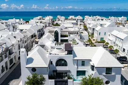 Alys Beach in Florida feels like Santorini but it's pure Gulf Coast The coastal town of Florida looks European Alys Beach in Florida is a coastal luxury community that reminds many visitors of Santorini. The bright white houses, the clean, modern lines and the peaceful streets make this a far cry from your typical American beach resort. You can see the white walls of the houses glowing in the sunlight as you stroll through town. You will walk along stone paths past quiet courtyards and elegant homes. The calm environment is enriched by purple flowers that hang from trellis. The Gulf of Mexico is visible in the distance. Its clear waters are surrounded by soft white sand. You might think of Greece, Spain or even the Caribbean when you first see it. At first glance, you might imagine Greece, Spain or the Caribbean. Small details remind you quickly that Florida is the place to be. The menus are filled with local seafood, and you can hear the Southern accents of the residents. The design is designed to make you feel as if you are in many different places. Alys Beach, located along Florida's picturesque 30A Highway, stands out among nearby coastal towns. The majority of beach towns around the region feature houses with colorful designs and a casual style. Alys Beach, on the other hand, follows an all-white architecture style. In 2004, the town's development was guided by a vision. The town's architecture is a blend of influences from various regions. Bermuda, Central America and Mediterranean countries are all represented in the design. The courtyards in Antigua and Guatemala have fountains. The island style architecture uses roof designs to collect rainwater. Tall structures at the entrance add Bermudian flair. Some places even hint at New Orleans' charm. The town has a relaxing yet elegant atmosphere thanks to the balconies and verandas that overlook tranquil courtyards. Enjoy a peaceful and walkable beach Alys Beach's layout is one of its most distinctive features. These streets were designed to be used by people walking or biking and not for cars. The streets are quiet and peaceful. You can hear the sea and bicycle bells instead of noise from the traffic. The town is easily accessible on foot. They will find small shops, cafes and spaces to relax in. A nearby coast adds to your experience. While the water is emerald-green, it feels like soft sand. This is the perfect place to relax. Florida Living: A New Vision Alys beach offers an alternative side to Florida. The beach town look is replaced by something refined and more global. It's not all about the beauty. The town's all-white design is not just about beauty. Each structure has a uniform style that gives it a timeless and clean feel. Many visitors say that the town is familiar but hard to locate. Alys Beach is unique because of its mix.