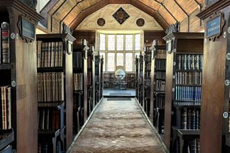 A 750-Year-Old Library That Still Tells Its Story The Merton College Library is more than a place for books. It is a piece of living history that dates back over seven centuries. Founded in 1276 this remarkable library existed long before the Aztec Empire even began. I find it amazing that it has been around for long. In its days books were stored in a locked chest instead of on shelves. A few people had access to it. Three key-holders had to come to unlock it. Books were not easy to replace then. Each one was written by hand, which took months to do. That made them very valuable. How the Library Began The librarys roots go back to a rule set by the Archbishop of Canterbury in the century. The college fellows had to donate books. This simple rule helped build one of the academic collections in England. I think it's cool how a simple rule led to something big. At that time libraries looked very different. There were no rows of shelves or casual browsing. Instead books were carefully. Loaned out through a formal process. The community would gather when access was needed which made reading a shared activity. People would come together to read and discuss books. A Legacy That Spans Generations Over the centuries the Merton College Library has served notable figures. Scholars from the century studied there. Later famous writer J.R.R. Tolkien also used its resources. The librarys long history even stretches across global events like the Black Death and the COVID-19 pandemic. I am amazed by its continuity. This uninterrupted use makes the Merton College Library unique. Few institutions can claim such a history. Why Its History Matters Today During the period many believed it was the oldest library in England. Some even claimed it was the oldest in the world. Today historians take a careful view. They say defining a "library" is not simple. Early collections developed in stages and not all looked like libraries. Still Mertons collection remains special. Its long survival, traditional systems and cultural impact make it stand out. Today it offers a glimpse, into how knowledge was preserved and shared in the medieval world. The Merton College Library is a treasure that continues to tell its story.