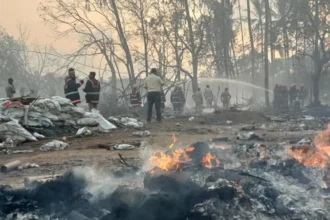 Explosion in Kerala Firecracker Unit Kills Thirteen During Festival Preparations Incident Details A powerful explosion hit a firecracker making unit in Thrissur, Kerala, in southern India. Thirteen workers lost their lives in the blast. Around forty workers were inside a cluster of sheds preparing fireworks for an upcoming Hindu festival. The explosion was so strong that people living several kilometers away felt it. Some residents thought it was an earthquake. Nearby homes also suffered damage due to the blast. Casualties and Rescue Efforts Emergency teams and local residents rushed to the site right after the explosion. They helped pull injured workers and bodies from the damaged sheds. Several people were injured in the incident. Officials confirmed that five of them are in critical condition and receiving treatment in hospitals. Link to Thrissur Pooram Festival The workers were preparing fireworks for the Thiruvambady Temple, one of the main participants in Thrissur Pooram. This is a major annual temple festival in Kerala known for its large fireworks displays. The fireworks are usually prepared in designated units that operate with permission for festival use. Large crowds gather every year to watch the final fireworks show during the festival. Safety Concerns and Past Incidents Firecracker factories in India have faced repeated safety issues over the years. Similar accidents have occurred in nearby regions, including Tamil Nadu, where a recent explosion killed many people. The industry is often linked with poor safety conditions, especially during peak festival production periods. Workers handle explosive materials in tightly packed sheds, which increases risk. Cause Still Under Investigation Officials have not confirmed the exact cause of the explosion. Some local authorities suggested that high temperatures may have contributed to the blast. However, investigators say the cause is still unclear and under review. Authorities are also checking how many workers were present at the time and whether safety rules were properly followed.