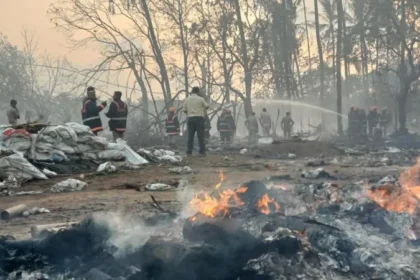 Explosion in Kerala Firecracker Unit Kills Thirteen During Festival Preparations Incident Details A powerful explosion hit a firecracker making unit in Thrissur, Kerala, in southern India. Thirteen workers lost their lives in the blast. Around forty workers were inside a cluster of sheds preparing fireworks for an upcoming Hindu festival. The explosion was so strong that people living several kilometers away felt it. Some residents thought it was an earthquake. Nearby homes also suffered damage due to the blast. Casualties and Rescue Efforts Emergency teams and local residents rushed to the site right after the explosion. They helped pull injured workers and bodies from the damaged sheds. Several people were injured in the incident. Officials confirmed that five of them are in critical condition and receiving treatment in hospitals. Link to Thrissur Pooram Festival The workers were preparing fireworks for the Thiruvambady Temple, one of the main participants in Thrissur Pooram. This is a major annual temple festival in Kerala known for its large fireworks displays. The fireworks are usually prepared in designated units that operate with permission for festival use. Large crowds gather every year to watch the final fireworks show during the festival. Safety Concerns and Past Incidents Firecracker factories in India have faced repeated safety issues over the years. Similar accidents have occurred in nearby regions, including Tamil Nadu, where a recent explosion killed many people. The industry is often linked with poor safety conditions, especially during peak festival production periods. Workers handle explosive materials in tightly packed sheds, which increases risk. Cause Still Under Investigation Officials have not confirmed the exact cause of the explosion. Some local authorities suggested that high temperatures may have contributed to the blast. However, investigators say the cause is still unclear and under review. Authorities are also checking how many workers were present at the time and whether safety rules were properly followed.