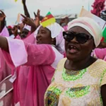 Thousands gather for open-air mass led by Pope Leo XIV Massive crowd welcomes Pope in Douala Over 120,000 people gathered at Douala for a massive open-air Mass, led by Pope Leo XIV. It is the largest crowd he has seen during his 11 day tour of Africa. Early in the morning, the Japoma stadium and surrounding areas were crowded. People had arrived early the previous night to get a prime spot. As Pope Francis entered his Popemobile in the Vatican, thousands of people cheered and waved flags. They also captured the moment with their smartphones. A message of unity and peace The Pope's focus during the Mass was on the promotion of peace, community development, and discipline. The Pope urged the young to make good use of their talent and not choose harmful things. He warned people against violent acts and grabbing for quick gain that can harm society. He urged people to be honest and strive for progress. The message was sent shortly after his trip to the Anglophone Cameroon region which has been ravaged by conflict for many years. After hearing him speak, many attendees felt hopeful. Artificial Intelligence Risks In Yaounde the Pope raised concern about artificial intelligence. The Pope said that artificial intelligence can cause divisions and fear to spread if it is used carelessly. He said that people can lose their connection to reality if they depend too heavily on digital simulations. This can lead to isolated groups, and reduce meaningful interaction between people. African natural resources: a concern He also criticised the high demand for Africa’s natural resources. The Pope emphasized minerals such as cobalt which is widely used for modern technology, including AI. He said that uncontrolled mining of these resources would harm local communities and increase inequality. Faithfulness, dedication, and resiliency The worshippers were deeply involved despite the heat. Others held books or umbrellas to protect themselves from the heat. Some knelt down, prayed or lifted their hands to show devotion. It was a powerful display of unity and faith amongst people with different backgrounds. The event was described by many as an emotional experience. The next stops in Africa on the tour The Pope is on a tour of Africa. He will then travel to Angola, and finally Equatorial Guinea to conclude his journey.