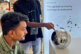 Tinder, Zoom and Tinder users can now be verified by using eye scans Tinder and Zoom have launched a new system of identity that relies on iris scans to verify whether or not a person is human. This feature is intended to help reduce the number of fake accounts, bots and AI-generated identities, which are increasingly difficult to detect on the internet. After the eye scan, users receive a badge that says "Proof of Humanity". The badge is displayed on the user's profile to prove that they are a genuine person. The Iris Scan system works The user can verify their identity using a mobile application or an orb-shaped scanner. This scans captures the colored portion of the eye, the iris. After the scanner is approved, a digital ID called World ID will be created. The ID can be stored in the phone of the user and used on all supported platforms. World Network Behind the Technology Worldcoin, formerly known as Worldcoin, is the source of this technology. The technology is being developed by Tools for Humanity. Sam Altman co-founded and chairs the startup, which also runs OpenAI. As online content grows increasingly automated, the company claims that this system will separate human accounts from AI-driven ones. Why platforms are adopting it Tinder is facing a problem of fake profiles and fraudulent accounts. These accounts often use AI to create convincing images and conversation to fool users. Match Group which is Tinder's owner, added video self-portrait checks. This new option to scan your iris is intended to provide a more robust level of security. Zoom also faces a new risk. The DeepFake Technology has enabled people to pretend to be real during video chats, such as executives or coworkers. Growing Concerns About AI Scams The use of deepfake fraud is on the rise. One reported case from Hong Kong involved a worker being tricked by AI-generated fakes into sending $25 million. In the next few years, AI-driven fraud may cause losses of tens or even hundreds of millions of dollars. The Next Step World ID will allow Tinder and Zoom to scan their iris and verify identity if desired. These companies claim that this will help to restore trust when it comes to online interactions, where AI impersonation has become more prevalent.