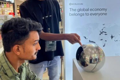 Tinder, Zoom and Tinder users can now be verified by using eye scans Tinder and Zoom have launched a new system of identity that relies on iris scans to verify whether or not a person is human. This feature is intended to help reduce the number of fake accounts, bots and AI-generated identities, which are increasingly difficult to detect on the internet. After the eye scan, users receive a badge that says "Proof of Humanity". The badge is displayed on the user's profile to prove that they are a genuine person. The Iris Scan system works The user can verify their identity using a mobile application or an orb-shaped scanner. This scans captures the colored portion of the eye, the iris. After the scanner is approved, a digital ID called World ID will be created. The ID can be stored in the phone of the user and used on all supported platforms. World Network Behind the Technology Worldcoin, formerly known as Worldcoin, is the source of this technology. The technology is being developed by Tools for Humanity. Sam Altman co-founded and chairs the startup, which also runs OpenAI. As online content grows increasingly automated, the company claims that this system will separate human accounts from AI-driven ones. Why platforms are adopting it Tinder is facing a problem of fake profiles and fraudulent accounts. These accounts often use AI to create convincing images and conversation to fool users. Match Group which is Tinder's owner, added video self-portrait checks. This new option to scan your iris is intended to provide a more robust level of security. Zoom also faces a new risk. The DeepFake Technology has enabled people to pretend to be real during video chats, such as executives or coworkers. Growing Concerns About AI Scams The use of deepfake fraud is on the rise. One reported case from Hong Kong involved a worker being tricked by AI-generated fakes into sending $25 million. In the next few years, AI-driven fraud may cause losses of tens or even hundreds of millions of dollars. The Next Step World ID will allow Tinder and Zoom to scan their iris and verify identity if desired. These companies claim that this will help to restore trust when it comes to online interactions, where AI impersonation has become more prevalent.