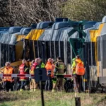 Head-on Train Collision Near Copenhagen Leaves Multiple Injured Crash Location and Time A serious train collision happened early Thursday morning in North Zealand, Denmark, between Hillerød and Kagerup, around 40 km northwest of Copenhagen. The accident occurred at 06:29 local time on a railway line that serves commuters, students, and workers in the region. Casualties and Emergency Response According to police and medical officials, 37 passengers were on board the two trains. Five people were critically injured, while 13 others sustained minor to moderate injuries. Emergency teams quickly responded and transported the injured to nearby hospitals, including air evacuation for the most serious cases. Fire and rescue services reached the scene shortly after the crash was reported. Authorities confirmed that several railway staff members were also injured in the incident. What Officials Know So Far Investigators have not yet confirmed the cause of the collision. The Danish Accident Investigation Board is working alongside police to determine what went wrong. Early assessments suggest multiple possible causes, including a signalling system failure or human error. Officials have stressed that it is too early to draw conclusions. Local and National Reaction The mayor of Gribskov municipality described the incident as deeply distressing and said the injured included local residents who regularly use the line for daily travel. Danish Prime Minister Mette Frederiksen expressed serious concern over the accident and said she was closely monitoring developments. Rail operator Lokaltog called the crash one of the most severe incidents the railway sector can face. The company confirmed that it is gathering technical data to support the investigation. Investigation Continues Specialists from the national railway safety authority arrived at the site during the morning hours. They are examining track systems, signalling data, and operational records to understand how two trains ended up on a collision path. Authorities have emphasized that all possibilities remain open while the investigation is ongoing.