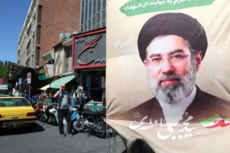 Who Is Really Running Iran Right Now Leadership at the Top Looks Unclear Iran’s political system officially places ultimate authority in the hands of the supreme leader. After the death of Ali Khamenei at the start of the conflict with the United States and Israel, his son Mojtaba Khamenei was reported to have taken over the role. In theory, this position controls major national decisions, including war strategy, foreign policy, and security direction. In practice, the situation now appears far less clear. Mojtaba Khamenei has not appeared publicly since assuming power. His absence has created uncertainty inside and outside Iran about who is actually directing the state. Limited Visibility and Growing Questions There are few confirmed signs of direct leadership activity. Only a small number of written messages have been released under his name, including statements about key military positions. Reports from Iranian sources suggest he may have been injured during early strikes in the conflict. His condition and ability to communicate have not been independently confirmed. This lack of visibility has weakened the usual signals of leadership. In Iran, public presence and speeches are often used to show authority and control. That pattern is missing now. Power Appears Less Centralized Observers note that decision making inside Iran now seems more divided than before. Instead of a single clear authority, multiple institutions appear to be involved in shaping outcomes. Some believe the leadership transition happened too quickly for full control to be established. Others point to internal disruption caused by ongoing military pressure. The result is a system where direction is harder to read, and authority is less clearly concentrated at the top. Diplomacy Continues but with Limits Iran’s foreign ministry continues to engage in diplomatic talks with the United States under President Masoud Pezeshkian and Foreign Minister Abbas Araghchi. However, their influence appears limited. Strategic decisions do not seem to come directly from the diplomatic team. At times, contradictions have appeared in official messaging, including mixed signals over key security issues. This suggests that diplomacy is reacting to events rather than shaping them. Parliamentary leadership has also taken a visible role in negotiations, adding another layer to an already complex structure. Military and Political Tracks Not Fully Aligned Military decision making appears to operate on a separate track from diplomacy. This has created inconsistencies in messaging and strategy. Officials involved in talks often adjust positions quickly, reflecting shifting instructions or unclear authority lines. This divide has reinforced the perception that Iran’s internal leadership structure is under strain during the conflict. Conclusion: A System Under Pressure Iran’s leadership is formally defined but practically difficult to observe at the moment. The absence of a visible central figure, combined with fragmented decision making, has created uncertainty at the highest level of the state.