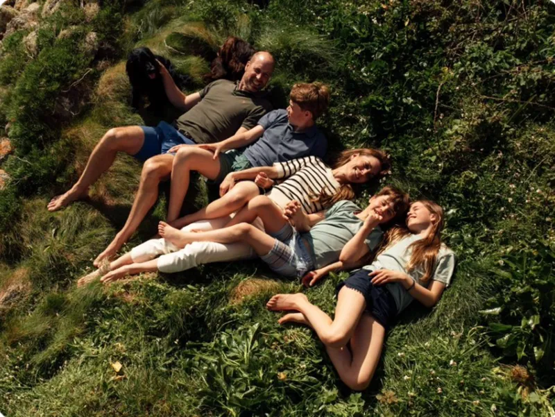 Royal Couple Celebrate 15 Years of Marriage Prince William and Catherine, Princess of Wales, marked their 15 years of marriage by sharing a new family portrait on social media. The couple posted a heartfelt image with a simple heart emoji and a caption celebrating their anniversary. The photo shows the royal family relaxed on grass during an Easter break in Cornwall. Photographer Matt Porteous captured the moment. Family Moment in Cornwall In the image, William and Catherine smile alongside their children, Prince George, Princess Charlotte, and Prince Louis. Their family dog also appears in the portrait. The setting reflects a calm and personal family moment away from official duties. Wedding and Early Life Together The couple married at Westminster Abbey in London in 2011 in a global televised ceremony. They first met while studying at the University of St Andrews. After their wedding, they spent their early married years in Anglesey. Prince William trained there as an RAF search and rescue pilot. He later reflected positively on that period, saying he valued the experience, the work, and the strong sense of teamwork. Growing Family Over the Years Prince George was born in 2013, marking the couple’s first child. Princess Charlotte followed two years later, and Prince Louis was born in 2018. The family has since become one of the most followed royal households in the world.