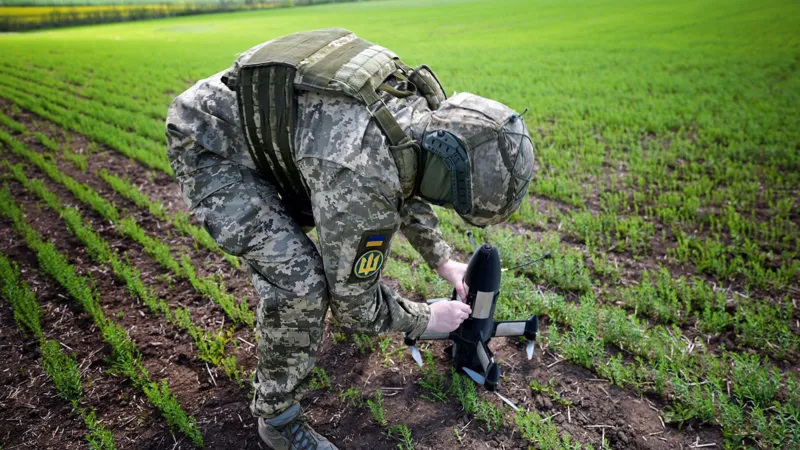 Ukraine expands drone defense using AI and private sector support Ukraine is strengthening its air defense system to counter growing drone attacks. The country is combining artificial intelligence, private companies, and ground based weapons to protect its airspace and critical infrastructure. Building a nationwide detection network Officials are working on a system that can monitor the entire country and identify incoming threats in real time. A senior coordinator involved in the project said the goal is to use every available resource to track targets across all regions. This approach focuses on full coverage of Ukrainian airspace. The system is designed to improve response speed and reduce gaps in detection. Private companies join air defense efforts Around twenty five private companies have joined the initiative. Many of them see this as both a national duty and a way to protect their own facilities. These companies are now contributing technology, infrastructure, and operational support to strengthen Ukraine’s defense capacity. Protecting energy and industrial infrastructure Russia has repeatedly targeted Ukraine’s energy grid, especially during winter months. These strikes have caused widespread power outages and disruption for millions of people. To reduce damage from future attacks, private sector partners are helping secure factories, power facilities, and other critical sites. Armed drone defense systems in frontline regions One private company, Carmine Sky, is already working in the Kharkiv region near the border area. The company has developed a network of towers equipped with remotely operated machine guns. These systems are designed to detect and destroy incoming drones before they reach sensitive targets. The setup allows faster response and reduces risk to human operators. AI driven air defense strategy Artificial intelligence plays a key role in coordinating detection and response. It helps process surveillance data and supports faster decision making in high pressure situations. Ukraine aims to connect these systems into one unified defense network that can respond quickly to multiple threats at the same time.