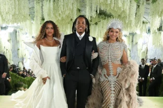 Met Gala 2026: Bold “Costume Art” Looks Steal the Spotlight The 2026 Met Gala once again proved why it is known as fashion’s biggest night. This year’s theme, “costume art,” pushed celebrities to go beyond traditional red carpet style and embrace creativity, drama, and storytelling through fashion. Held in support of the Metropolitan Museum of Art’s Costume Institute, the annual event brought together global stars, designers, and artists. The red carpet turned into a stage where imagination met high fashion. A Dramatic Opening on the Red Carpet Broadway performer Joshua Henry set the tone for the night. He delivered a live performance of the iconic song I Wanna Dance With Somebody, joined by dancers and a full band. The Met steps were transformed into a lush garden scene with moss-like details, adding a theatrical touch right from the start. Star-Studded Guest List and Hosts This year’s co-chairs included global icons like Beyoncé, Nicole Kidman, Venus Williams, and Anna Wintour. Their presence added prestige and influence to an already high-profile event. Celebrities such as Madonna, Sabrina Carpenter, Naomi Osaka, and Angela Bassett also walked the carpet, each bringing their own interpretation of the theme. Fashion That Pushed Boundaries Some stars fully committed to the “costume art” concept. Bad Bunny, Heidi Klum, and Katy Perry stunned fans with bold transformations. Their outfits blurred the line between fashion and performance art, making them almost unrecognisable. Beyoncé’s Grand Comeback After a decade-long absence, Beyoncé returned to the Met Gala in unforgettable style. She wore a striking gown designed by Olivier Rousteing. The outfit featured an intricate skeleton design and a dramatic feathered cape, perfectly matching the theme. She attended the event with her husband, Jay-Z, and their daughter, Blue Ivy Carter. At just 14, Blue Ivy became one of the youngest guests, drawing attention for her appearance alongside her parents. Beyoncé shared that she felt happy to return and enjoy the moment with her family, making her comeback even more special.