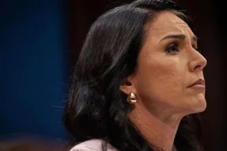 Tulsi Gabbard Resigns as US Intelligence Chief Amid Family Health Crisis Tulsi Gabbard has announced her resignation from the role of US director of national intelligence after her husband was diagnosed with bone cancer. She said her family now needs her full attention during a difficult time. Her resignation will officially take effect on 30 June. President Donald Trump confirmed that Aaron Lukas, the principal deputy director, will serve as acting intelligence chief after her departure. Gabbard Says Family Comes First In her resignation letter, Gabbard explained that her husband Abraham is preparing for a serious medical battle in the coming months. She said she could not continue managing one of the country’s most demanding national security positions while supporting her husband through treatment. Trump praised Gabbard for her work in the administration and said she had served the country with dedication. He also expressed confidence that her husband would recover successfully. Growing Tensions Over Iran Policy Gabbard remained one of Trump’s strongest political allies during the 2024 presidential campaign. She later became a key figure in the administration after taking charge of US intelligence operations in early 2025. However, tensions reportedly increased inside the administration over the conflict with Iran. Gabbard has often supported a less aggressive foreign policy and previously warned against deep military involvement overseas. Questions about Iran’s nuclear program also placed her under political pressure. During congressional hearings, lawmakers challenged differences between intelligence reports and statements made by the White House regarding Iran’s nuclear capabilities. At one point, Trump publicly rejected Gabbard’s assessment that Iran was not actively building a nuclear weapon. He insisted Iran was very close to developing one and used that argument to defend US military action. Senior Officials Continue Leaving Administration Gabbard becomes the fourth Cabinet level official to leave the Trump administration this year. Earlier departures included Kristi Noem, Pam Bondi, and Lori Chavez-DeRemer. Her resignation also follows the earlier exit of former National Counterterrorism Center Director Joe Kent, who reportedly disagreed with the administration’s direction on Iran policy. Despite earlier disagreements, Gabbard later publicly supported Trump’s authority as commander in chief and defended his decisions regarding national security threats. What Happens Next? Aaron Lukas will temporarily oversee the Office of the Director of National Intelligence while the administration prepares to nominate a permanent replacement. Gabbard has not announced her future political plans. For now, she says her focus will remain on supporting her husband and family during his treatment.