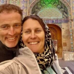 British Couple Start Hunger Strike in Iran Prison A British couple, Lindsay and Craig Foreman, are on a hunger strike while being held in Iran. They are currently detained in Tehran at Evin Prison after being accused of espionage, a charge they strongly deny. The couple was arrested in January last year while traveling through the country on a global motorbike trip. 10 Year Prison Sentence and Ongoing Claims of Innocence An Iranian court sentenced both Lindsay and Craig Foreman to 10 year prison terms in February on spying charges. They reject all allegations and insist they have done nothing wrong. They had earlier described life inside prison as slow and draining, saying they felt they were “wasting their lives” and trapped without hope. Hunger Strike Triggered by Phone Restrictions Craig Foreman is believed to have been on a hunger strike for about 12 days. He started refusing food after prison authorities cut off phone access in early May. Lindsay Foreman briefly stopped her own hunger strike after being told she would regain contact with her family. However, she later resumed her protest when communication issues continued. Family members say the situation inside the prison has become critical and needs urgent attention. Family Raises Alarm Over Health Risks Lindsay’s son, Joe Bennett, has warned that the situation could turn into a medical emergency if it continues. He has called for immediate action from the UK government and urged Foreign Secretary Yvette Cooper to intervene directly. He said the case cannot wait due to the risk to both lives. The UK Foreign Office says it is continuing efforts to secure their release and has described their detention as unjustified and deeply concerning. Public Support and Growing Pressure Supporters from the adventure motorbike community recently organized a ride from Kensington Palace to Parliament Square. The event marked 500 days since the couple were first detained. The family continues to push for faster diplomatic action while the couple remains in prison under worsening conditions.