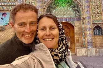 British Couple Start Hunger Strike in Iran Prison A British couple, Lindsay and Craig Foreman, are on a hunger strike while being held in Iran. They are currently detained in Tehran at Evin Prison after being accused of espionage, a charge they strongly deny. The couple was arrested in January last year while traveling through the country on a global motorbike trip. 10 Year Prison Sentence and Ongoing Claims of Innocence An Iranian court sentenced both Lindsay and Craig Foreman to 10 year prison terms in February on spying charges. They reject all allegations and insist they have done nothing wrong. They had earlier described life inside prison as slow and draining, saying they felt they were “wasting their lives” and trapped without hope. Hunger Strike Triggered by Phone Restrictions Craig Foreman is believed to have been on a hunger strike for about 12 days. He started refusing food after prison authorities cut off phone access in early May. Lindsay Foreman briefly stopped her own hunger strike after being told she would regain contact with her family. However, she later resumed her protest when communication issues continued. Family members say the situation inside the prison has become critical and needs urgent attention. Family Raises Alarm Over Health Risks Lindsay’s son, Joe Bennett, has warned that the situation could turn into a medical emergency if it continues. He has called for immediate action from the UK government and urged Foreign Secretary Yvette Cooper to intervene directly. He said the case cannot wait due to the risk to both lives. The UK Foreign Office says it is continuing efforts to secure their release and has described their detention as unjustified and deeply concerning. Public Support and Growing Pressure Supporters from the adventure motorbike community recently organized a ride from Kensington Palace to Parliament Square. The event marked 500 days since the couple were first detained. The family continues to push for faster diplomatic action while the couple remains in prison under worsening conditions.