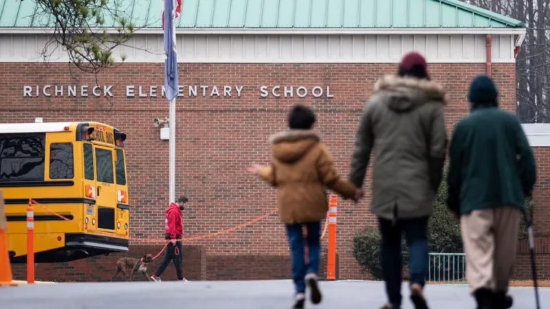 Court Dismisses Charges Against School Official in Virginia Shooting Case Case Background A court in Virginia has dismissed all criminal charges against a former assistant principal from Richneck Elementary School. The case was connected to a classroom shooting in 2023 involving a six year old student. The incident raised serious concerns across the United States about school safety and supervision. What Happened in the Classroom In January 2023, a first grade student brought a firearm into school and fired a single shot during class. The bullet struck teacher Abigail Zwerner in the hand and chest. She required surgery after the attack. The child’s mother, Deja Taylor, later served jail time on a separate drug related firearm charge tied to the weapon used in the shooting. Charges Against the Assistant Principal Former assistant principal Ebony Parker faced eight felony counts of child abuse. Prosecutors argued she failed to act on warnings that the child may have brought a gun to school. Her defense team said the evidence did not meet the legal standard required for conviction and asked the court to dismiss the charges. Judge’s Decision Circuit Court Judge Rebecca Robinson agreed with the defense and dismissed all charges. She stated that the prosecution did not present enough evidence to continue the case. During the ruling, Parker showed an emotional reaction as the decision was announced. The judge also acknowledged the seriousness of the incident, describing it as deeply troubling while explaining the legal reasoning behind the dismissal. Impact of the Case The shooting and the court outcome have sparked ongoing debate about responsibility within schools, child safety policies, and how warning signs are handled by staff and administrators.