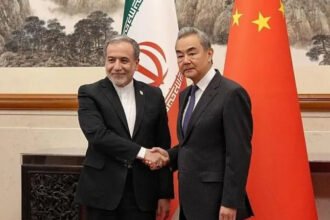 China Urges Quick Reopening of Strait of Hormuz Amid Iran Talks Beijing Pushes for De escalation and Safe Maritime Routes China has called for the Strait of Hormuz to reopen as quickly as possible during high level discussions with Iran. Chinese Foreign Minister Wang Yi made the appeal in Beijing during talks with Iranian Foreign Minister Abbas Araqchi. This was Araqchi’s first visit to China since the Iran war began. Wang Yi stressed that reducing tensions is now an urgent priority. He said a lasting ceasefire must be achieved and both sides should continue negotiations instead of returning to conflict. China also expressed readiness to support efforts aimed at calming the situation. Focus on Peace Talks and Regional Stability During the meeting, Wang Yi highlighted that reopening negotiations is essential for long term stability. He encouraged all parties to avoid further escalation and return to diplomatic solutions. Chinese officials said Beijing supports dialogue between Iran and other global powers, including the United States. China also stated that it appreciates Iran’s position against developing nuclear weapons. Iranian officials, in return, said cooperation between China and Iran will continue to grow stronger in the coming years. Strait of Hormuz and Global Energy Concerns The Strait of Hormuz remains one of the most important oil transport routes in the world. It has faced disruptions due to ongoing tensions, including restrictions placed by both Iran and the United States. China emphasized the importance of keeping this route open for global trade. Wang Yi said the international community expects safe and normal navigation to be restored as soon as possible. Beijing also criticized actions that restrict maritime access, calling them harmful to fragile peace efforts in the region. China Energy Dependence and Diplomatic Role China remains one of the largest buyers of Iranian oil, despite existing sanctions from the United States. In 2025, China imported around 1.38 million barrels of crude oil per day from Iran, which accounts for a significant share of its total imports. Because of this dependence, stability in the Strait of Hormuz is a major concern for Beijing. Chinese leaders have taken a cautious diplomatic approach and continue to encourage negotiations instead of military escalation. Global Political Context The discussions come shortly before a planned meeting between the United States president and China’s leadership. The Iran conflict and security of global shipping routes are expected to be part of those talks. Former remarks from the United States leadership suggested that China has not directly challenged US positions in the region. However, tensions around maritime security and energy supply remain a key global concern.