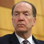 China urged to ease food and fertiliser stockpiles amid global supply strain Key concerns over global shortages Former World Bank president David Malpass has called on China to reduce its large reserves of food and fertiliser to help ease growing pressure on global supply chains. He made the remarks ahead of a high level meeting between Donald Trump and Xi Jinping in Beijing. Malpass said China holds the largest global stock of food and fertiliser materials and argued that easing these reserves could help stabilise markets during a period of disruption caused by conflict affecting key shipping routes. Fertiliser supply disruptions deepen crisis Global fertiliser supplies have been under strain as transport routes face interruptions linked to conflict in the Middle East. Experts warn that reduced availability of fertiliser could significantly lower agricultural output worldwide. Industry leaders estimate that the disruption could threaten billions of meals each week and place the greatest burden on low income countries that depend heavily on imported food and fertiliser. One major fertiliser industry executive has warned that lower usage could reduce crop yields and trigger competition among countries for limited food supplies. China’s export limits under scrutiny China has restricted exports of several fertiliser types since March, stating that it aims to secure domestic supply. These controls add to earlier limits introduced over recent years. The country plays a major role in global fertiliser production, contributing around a quarter of worldwide output. Its exports previously generated more than thirteen billion dollars annually. Malpass criticised Beijing for continuing to present itself as a developing economy despite its position as the world second largest economy. He suggested that China should reconsider its status in global institutions such as the World Trade Organization and international financial bodies. China responds to criticism A spokesperson for the Chinese embassy in Washington said China remains committed to supporting stability in global food and fertiliser markets. The statement added that the causes of current supply disruptions should not be attributed solely to China. Global implications ahead of diplomatic talks The comments come as international leaders prepare for discussions aimed at addressing trade tensions, supply chain instability, and energy security concerns. Fertiliser availability and food security are expected to be key topics during the meeting.