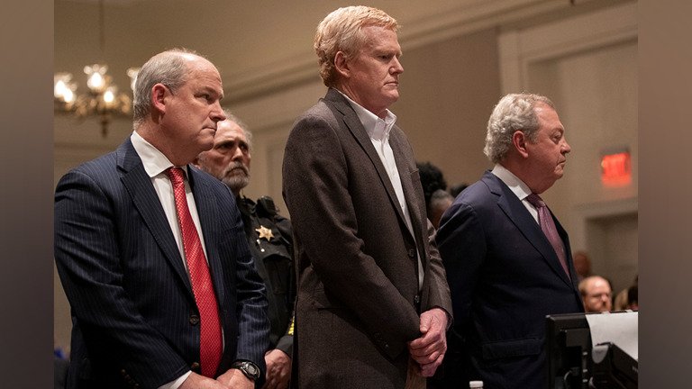 Court Orders New Trial for Alex Murdaugh After Murder Conviction Overturned Introduction A South Carolina court has overturned the murder convictions of former lawyer Alex Murdaugh and ordered a new trial. The decision relates to the 2021 killings of his wife, Maggie Murdaugh, and son, Paul Murdaugh. Murdaugh is already serving two life sentences for murder, along with an additional 40 years for separate federal financial crimes. Why the Conviction Was Overturned The South Carolina Supreme Court ruled in a 5 to 0 decision that Murdaugh did not receive a fair trial. The judges found that the Colleton County Clerk of Court influenced the jury in a way that could have affected the verdict. According to the ruling, the clerk made comments during the trial that crossed a line. One juror stated in an affidavit that she was told to “watch Murdaugh closely,” which impacted how she viewed the case. Allegations of Jury Influence Jurors also reported that they were advised not to trust the defense arguments. Some said they were told not to be misled by the evidence presented by Murdaugh’s legal team. Others recalled hearing remarks suggesting the jury should reach a quick decision once deliberations began. These actions raised concerns about jury independence and fairness during the trial. Background of the Case Murdaugh was once a powerful and well known attorney in South Carolina. His criminal trial drew global attention and was widely followed through live broadcasts, podcasts, and documentaries. He was found guilty after a six week trial. The murders of his wife and son took place near the family’s dog kennels in June 2021. What Happens Next With the conviction overturned, Murdaugh will face a new trial. The court’s decision reopens one of the most closely watched criminal cases in recent US legal history.
