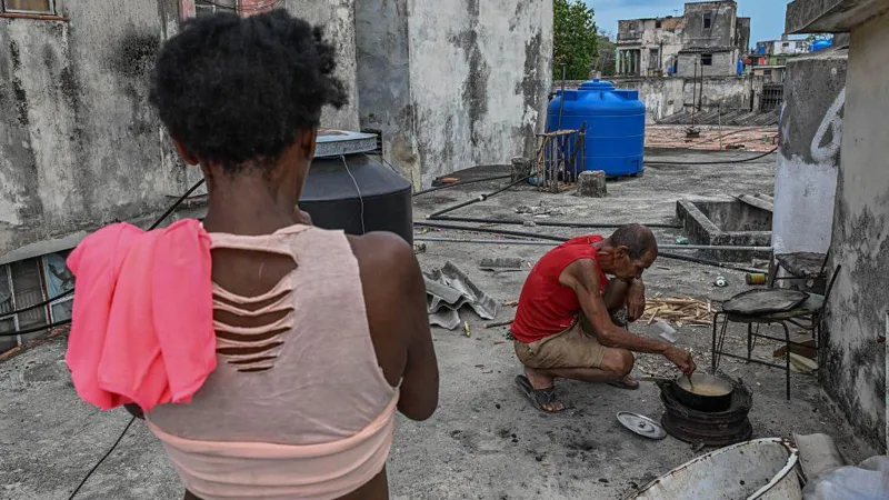 fe The crisis has been driven by a severe lack of diesel and fuel oil, which are essential for electricity generation. Reports indicate the country’s power system is under extreme pressure, with hospitals struggling to operate normally and many schools and government offices shutting down. Tourism, one of Cuba’s key income sources, has also been heavily disrupted. Recent reporting shows parts of Havana and other regions have experienced extremely long power cuts, in some cases lasting most of the day, as the national grid weakens further. Tensions over fuel supply and sanctions Cuban officials argue that US restrictions on fuel imports are the main reason for the shortage. They say these measures have reduced or stopped shipments from traditional suppliers such as Venezuela and Mexico. US officials, however, have defended their policy, saying the economic pressure is linked to broader political conditions and governance issues in Havana. Washington has also renewed its aid offer while maintaining criticism of Cuba’s leadership. Rare protests highlight public frustration The worsening situation has triggered rare street protests in Havana and other cities. Residents have demonstrated against prolonged blackouts, with growing anger over food spoilage, lack of electricity, and disruptions to essential services. Key point Cuba is now balancing between accepting external assistance and managing a deepening energy emergency that is already affecting healthcare, education, and public order.