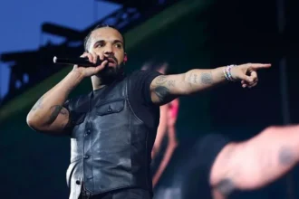 Drake Targets Kendrick Lamar and Others in Surprise Triple Album Release Drake revisits Kendrick Lamar feud in new music Drake has sparked fresh attention after using his new triple album drop to touch on his long running conflict with Kendrick Lamar. Listeners quickly pointed out lyrics that appear to reference the rivalry that escalated in 2024. In one track, Drake questions public charity moments in Compton, Los Angeles, suggesting that some artists use their hometown image for publicity before returning to a more private celebrity lifestyle. The line being discussed is: “Handin’ out turkeys on camera inside of your hood, then you go back to the hills.” Personal reflections in “Make Them Cry” On the opening track of Iceman, titled Make Them Cry, Drake appears more emotional and reflective. He references the pressure around the feud and his own mental state. He raps, “Tell us how it felt to meet the grim reaper. This album better have some big features. Well, sorry to burst your bubble, but I’m all alone for my mental health.” The track also includes a personal revelation, where he mentions that his father has been diagnosed with cancer, adding a more vulnerable tone to the project. Calls out other celebrities and athletes Beyond Kendrick Lamar, Drake also appears to address other public figures who were seen as supporting his rival during the beef. One line is widely interpreted as a reference to NBA star LeBron James, who attended a Kendrick concert during the height of the tension. He also seems to mention DJ Khaled, following criticism in public discourse about his silence on global issues, including the war in Gaza. Mixed reaction and streaming impact Critics have not fully reviewed the albums yet, but early audience response has been strong. Streaming platforms reportedly faced slowdowns and temporary crashes as fans rushed to play the 43 track release across Iceman, Habibti, and Maid of Honour. Album style breakdown The three projects each explore different sounds. Iceman focuses on rap and hip hop. Habibti leans into R&B influences. Maid of Honour brings a more dance inspired direction.