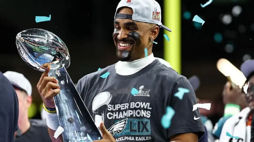 Eagles Set for London Game in 2026 NFL Season as League Expands Globally Philadelphia Eagles Head to London The Philadelphia Eagles will return to London in the 2026 NFL season. They will be part of a major international schedule that includes a record number of games outside the United States. The Eagles last played in London in 2018. The game in London will take place at Tottenham Hotspur Stadium. It adds to the league plan of growing American football across global markets. NFL Expands to Nine International Games The NFL will stage nine regular season games across four continents in 2026. These matches will be played in seven different countries. The United Kingdom will host three games again. The league is also expanding into new regions. Australia and France will host NFL games for the first time. This marks a major step in the sport’s international growth. Jaguars and 49ers Lead Overseas Schedule The Jacksonville Jaguars and San Francisco 49ers will each play two games outside the United States. The Jaguars will also host games in London across two consecutive weeks. The 49ers will take part in international fixtures that include matches in Mexico. The Baltimore Ravens and Dallas Cowboys will also play in Brazil in the league’s first game in Rio de Janeiro. London Games Schedule London will open its NFL run on 4 October. The Washington Commanders will face the Indianapolis Colts at Tottenham Hotspur Stadium. The Jaguars will then host the Eagles the following week at the same venue. After that, they will meet the Houston Texans at Wembley Stadium. This will be a divisional game, which is rare outside the United States. Games Across Europe and Australia The NFL will also stage games in other major cities. Paris will host its first NFL game at Stade de France, where the New Orleans Saints will meet the Pittsburgh Steelers. Real Madrid’s stadium will host a game between the Cincinnati Bengals and Atlanta Falcons. Munich will see the New England Patriots face the Detroit Lions. The opening international game of the season will be played in Australia. The Los Angeles Rams will face the San Francisco 49ers at the Melbourne Cricket Ground. League Reaction and Expansion Goals NFL UK and Ireland leadership said the 2026 schedule features major stadiums and strong matchups. They highlighted the Eagles as a strong and competitive team returning to London. They also noted that divisional games played outside the United States are still uncommon. The Jaguars hosting the Texans in London was described as a key moment for international growth.