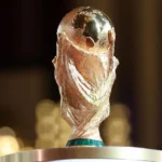 US Hotels Fear Weak World Cup Tourism as Bookings Fall Short Tourism expectations fail to match reality US hotels are worried the upcoming World Cup will not deliver the expected tourism boost. Many host cities are reporting lower-than-expected bookings, raising doubts about the event’s economic impact. A report from the American Hotel & Lodging Association shows demand is falling behind forecasts across most locations. The group represents more than 32,000 hotel properties and a large share of franchised hotels in the United States. Conflict between booking data and ticket sales The association says hotel demand does not match FIFA’s claim that over five million tickets have already been sold. It warns that the expected financial gains from the tournament could be lower than projected. Accusations over hotel room block bookings The report also criticizes FIFA for reserving large numbers of hotel rooms in advance. According to the association, this created artificial demand and pushed prices higher in early stages of booking. Later, FIFA cancelled a significant portion of those reservations. Hotel operators say this left gaps in availability and disrupted normal pricing patterns. FIFA has rejected these claims and does not agree with the criticism. Other factors behind weak demand Hotels say several issues are discouraging visitors. High ticket prices for matches are one concern. Expensive local transport and taxes are also adding pressure. Some operators also point to political tensions as another reason international travel interest has slowed. Economic outlook remains uncertain With lower bookings and mixed signals from ticket sales, the hospitality sector is now unsure about the World Cup’s overall economic benefit. Many hotels are preparing for weaker-than-expected revenue during the tournament period.