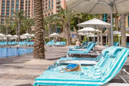 German Tourist Wins Refund After Sun Lounger Struggle in Greece Family Awarded Compensation Over Poolside Sunbed Problem A German tourist has received compensation after struggling to find a sun lounger during a family holiday in Greece. The court ruled that the holiday experience failed to meet reasonable expectations because guests regularly reserved loungers with towels for long periods. The tourist travelled to the Greek island of Kos with his wife and two children in 2024. According to court reports, the family woke up at 6:00 AM every day to search for available loungers near the pool. Despite their early efforts, they still could not secure seats because many guests had already reserved them using towels. The man explained that he spent nearly 20 minutes each morning looking for empty loungers. In some cases, his children had to sit or lie on the ground because no poolside space remained available. The family paid more than €7,000 for the package holiday. After returning home, the tourist filed a complaint against the tour operator. He argued that the company failed to properly manage the hotel’s sunbed policy and did not stop guests from reserving loungers for hours without using them. At first, the travel company offered the family a partial refund of €350. However, a district court in Hanover later ruled that the compensation was too low. Judges decided the family deserved a larger refund of €986.70 because the holiday conditions were “defective.” The court also stated that although the tour operator did not directly manage the hotel, it still had a responsibility to ensure guests had fair access to basic facilities such as poolside loungers. The issue of “sunbed wars” has become increasingly common at popular tourist resorts across Europe. Many holidaymakers reserve loungers early in the morning by placing towels on them before leaving for hours. Last year, several viral videos from Tenerife showed tourists rushing to claim poolside spots at sunrise. Some visitors were even seen sleeping beside pools to secure better locations. Travel companies and resorts are now trying different ways to solve the problem. Some hotels have introduced time restrictions on towel reservations, while others remove unattended belongings after a certain period. Meanwhile, some regions in Spain have warned tourists that they could face fines of up to €250 for reserving sun loungers and leaving them unused for long periods. Why Sun Lounger Disputes Are Increasing Tourism experts say overcrowded resorts and limited poolside seating continue to create frustration among travellers during peak holiday seasons. Families often expect relaxing pool access as part of their vacation package, especially when paying premium prices for resort stays. As more travellers share complaints online, hotels and tour operators may face increasing pressure to improve resort management and enforce fair sunbed rules.