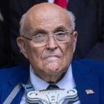 Rudy Giuliani Health Update: Breathing on His Own After Pneumonia Hospital Condition and Current Progress Former New York City mayor Rudy Giuliani is currently in hospital recovering from pneumonia. His spokesperson confirmed that he is now breathing without mechanical ventilation. He still remains under close medical supervision in critical but stable condition. Doctors had earlier placed him on ventilator support when his condition worsened. Medical teams removed the support after his breathing improved. His family and primary doctor are staying close during his treatment. Underlying Health Complications Giuliani has long been affected by respiratory issues linked to lung damage diagnosed after the September 11 attacks. His spokesperson said these existing conditions made it harder for his body to fight pneumonia. The illness developed quickly and severely impacted his breathing. Medical staff had to act fast to stabilize his oxygen levels before he improved. Connection to 9/11 Health Impact Giuliani was mayor of New York City during the September 11 attacks. He was widely recognized for his leadership during the crisis and earned the nickname America Mayor. Exposure to toxic dust and smoke after the attacks led to long term health problems for many first responders and city workers. Researchers have reported that these illnesses have claimed more lives over time than the attacks themselves. Political Career and Public Life After leaving office in 2001, Giuliani pursued national politics. He later ran for president during the Republican nomination race but did not win. He later became a key supporter and legal advisor for Donald Trump during the 2016 presidential campaign. Legal and Financial Challenges Following the 2020 election, Giuliani faced legal trouble after promoting false claims about election fraud. A jury later ordered him to pay damages to election workers in a defamation case. He also faced disbarment, losing his ability to practice law, and later declared bankruptcy due to financial pressures. Latest Health Situation His spokesperson says he is now improving and responding to treatment. Doctors continue to monitor him closely while he remains hospitalized.