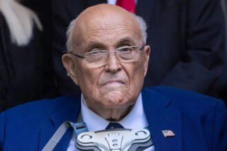 Rudy Giuliani Health Update: Breathing on His Own After Pneumonia Hospital Condition and Current Progress Former New York City mayor Rudy Giuliani is currently in hospital recovering from pneumonia. His spokesperson confirmed that he is now breathing without mechanical ventilation. He still remains under close medical supervision in critical but stable condition. Doctors had earlier placed him on ventilator support when his condition worsened. Medical teams removed the support after his breathing improved. His family and primary doctor are staying close during his treatment. Underlying Health Complications Giuliani has long been affected by respiratory issues linked to lung damage diagnosed after the September 11 attacks. His spokesperson said these existing conditions made it harder for his body to fight pneumonia. The illness developed quickly and severely impacted his breathing. Medical staff had to act fast to stabilize his oxygen levels before he improved. Connection to 9/11 Health Impact Giuliani was mayor of New York City during the September 11 attacks. He was widely recognized for his leadership during the crisis and earned the nickname America Mayor. Exposure to toxic dust and smoke after the attacks led to long term health problems for many first responders and city workers. Researchers have reported that these illnesses have claimed more lives over time than the attacks themselves. Political Career and Public Life After leaving office in 2001, Giuliani pursued national politics. He later ran for president during the Republican nomination race but did not win. He later became a key supporter and legal advisor for Donald Trump during the 2016 presidential campaign. Legal and Financial Challenges Following the 2020 election, Giuliani faced legal trouble after promoting false claims about election fraud. A jury later ordered him to pay damages to election workers in a defamation case. He also faced disbarment, losing his ability to practice law, and later declared bankruptcy due to financial pressures. Latest Health Situation His spokesperson says he is now improving and responding to treatment. Doctors continue to monitor him closely while he remains hospitalized.