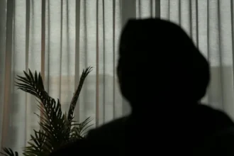 Imam accused of abusing girls using false spiritual claims in East London A woman using the name Aria has spoken about the abuse she suffered at the age of 13 by an imam in East London. She says the man convinced her that he had special powers and was offering spiritual healing. Claims of spiritual healing used as control Aria describes how the imam told her and other girls that they needed spiritual cleansing from bad spirits. She says he used this belief to gain trust from families in the community. He then abused the girls during what he presented as healing sessions. Aria says she believed his claims about supernatural power at the time. Fear and threats used to silence victims According to Aria, the imam warned her that speaking out would bring harm to her and her family. He claimed that curses and negative spiritual consequences would follow if she told anyone. This fear kept her silent for years. She says she truly believed something dangerous would happen if she reported the abuse. Multiple victims over several years Reports say the same man abused several girls over a period of about eleven years. The youngest victim was around 12 years old. The abuse followed a similar pattern in each case, with trust built through religious authority and fear used to maintain silence. Impact on survivors Aria says the experience left long term emotional harm. She now speaks out to help others understand how authority and belief can be misused.