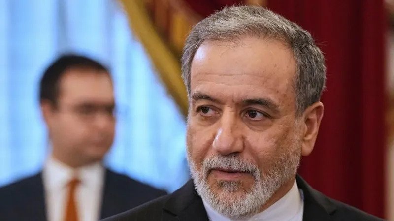 Rising tensions in the Gulf continue to threaten global energy supplies and diplomatic efforts Iran has sharply criticized the United States after fresh military activity near the Strait of Hormuz. Iranian Foreign Minister Abbas Araghchi said Washington keeps choosing military action even when diplomatic discussions remain possible. In a statement shared on X, Araghchi said Iran would never surrender to pressure or threats. He questioned whether the latest American actions were part of a deliberate strategy or the result of misleading political influence on US President Donald Trump. The exchange of accusations came after both countries blamed each other for recent attacks in the Strait of Hormuz. At the same time, US forces reportedly targeted more Iranian vessels in nearby waters. Despite the growing tensions, Trump stated that the ceasefire agreement still remains active. The ceasefire aims to create space for negotiations that could end the conflict involving the US, Israel, and Iran. US Secretary of State Marco Rubio said Iran is expected to respond soon to new American proposals. Speaking during a visit to Italy, Rubio expressed hope that Tehran would seriously consider the offer. Iran has continued to tighten control over the Strait of Hormuz while also targeting US allies in the Gulf region. The strategic waterway handles nearly 20% of the world’s oil and liquefied natural gas shipments. Concerns over disruptions in the area have already pushed global energy prices higher. Earlier this week, Trump approved and later paused a military operation aimed at helping thousands of stranded vessels move through the region. Many ships have remained stuck since February due to ongoing security threats. The United States has also maintained a naval blockade around Iranian ports to pressure Tehran into accepting American conditions. Iranian officials strongly criticized the move and called it unlawful. On Friday, US Central Command announced that American forces stopped two Iranian oil tankers from entering an Iranian port in the Gulf of Oman. According to the statement, US forces used precision strikes to disable the vessels after they allegedly violated the blockade. American officials also claimed that more than 70 tankers are currently being prevented from entering or leaving Iranian ports. The latest incidents followed Thursday’s confrontation in the Strait of Hormuz. US officials accused Iran of launching drones, missiles, and small boat attacks against American warships. Iran’s military leadership rejected the accusation and instead claimed that US forces targeted Iranian ships and carried out airstrikes on coastal areas. Reports from Iranian authorities said one cargo vessel near Minab caught fire during the attacks. The situation has further increased fears of a wider regional conflict and deeper instability in global energy markets.