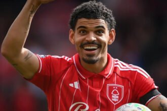 Morgan Gibbs White Emerges as Strong England Number 10 Option Gibbs White Impresses with Strong Premier League Form Morgan Gibbs White has played a key role in Nottingham Forest’s push toward Premier League safety. His form in the second half of the season has been especially strong and hard to ignore. He has scored thirteen goals in thirty five Premier League matches this season. Seven of those goals have come since the start of March. This sharp rise in output has pushed him into the spotlight at a crucial time. His performances show confidence, sharp movement, and better decision making in attacking areas. Forest have also benefited from his creativity and goal threat in key matches. England Number 10 Race Heats Up England manager Thomas Tuchel left Gibbs White out of a thirty five player squad for recent international friendlies against Japan and Uruguay. However, his recent form has changed the conversation around his national team future. The number ten position for England is now highly competitive. Gibbs White is now being discussed as a serious option for the role at the upcoming World Cup. He has added goals, assists, and energy in advanced midfield areas. This combination has made him difficult to ignore. Direct Comparison with Cole Palmer In Nottingham Forest’s three to one win over Chelsea, both Morgan Gibbs White and Cole Palmer featured in the same match for a short period. Palmer started for Chelsea but struggled to influence the game. He also missed a penalty and found it difficult to create chances. His season has been affected by injuries and limited impact, with only five goal contributions overall. Gibbs White came on in the second half and quickly made an impact. He provided an assist within minutes of entering the game. His direct involvement highlighted his current confidence and match sharpness. Competition for the Number 10 Role Despite his form, Gibbs White faces strong competition for the England number ten role. Other players in contention include Jude Bellingham from Real Madrid, Eberechi Eze from Arsenal, Morgan Rogers from Aston Villa, and Phil Foden from Manchester City. Each player brings different strengths, which makes the final decision more complex. England now have several creative midfield options, and consistency will likely decide who earns the starting role.